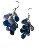 Pair of blue teardrop earrings on a white background