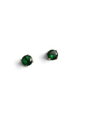 A pair of round-cut green gemstone stud earrings in a four-prong setting, shown on a plain white background.