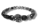 Bracelet with black and gray beads on a white background