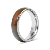 Ring with brown  inlay and silver metal band on a white background