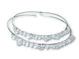 Silver hoop earrings with clear gemstones on a white background