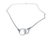 Silver necklace with interlocking rings on a white background