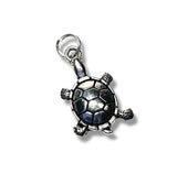 Silver turtle pendant on a white background