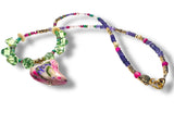 Colorful beaded necklace with a heart-shaped pendant on a white background