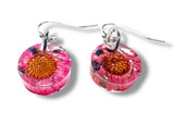 Pink floral earrings with a white background