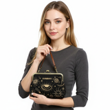 Woman holding a black handbag with gold designs on a white background