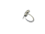 Silver ring with a leaf design on a white background