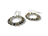 Pair of hoop earrings with beaded design on a white background