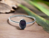 Oval Tourmaline Ring -black tourmaline on wood and leaf background