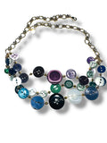 Necklace with colorful button-like beads on a white background