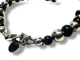 Bracelet with blue goldstone and silver beads on a white background