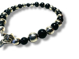 Bracelet with blue goldstone and silver beads on a white background