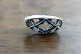 Gothic Cathedral Ring -silver ring with a cathedral window style. shown on dark wood background.