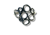 Silver ring with multiple circular loops on a white background