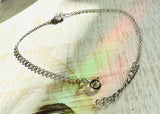 Lucky Clover Silver Chain Bracelet - on white washed wood background