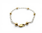Gold and silver bracelet on a white background