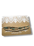 Set of beaded bracelets on a Janine Design branded card with lace design