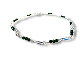 Necklace with green beads and silver chain on a white background