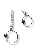 Two heart-shaped jewelry pieces on a white background