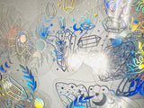 Decorative stickers with etched designs of crystals and celestial elements on a gray background.