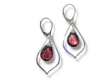 Silver earrings with red gemstones on a white background