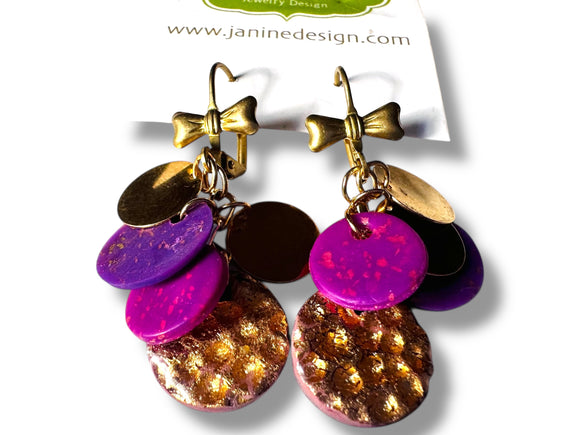 Colorful earrings with gold accents on a white background