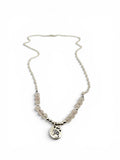 rose quartz beads with silver paw stamped round charm.