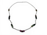 Necklace with multicolored Tourmaline  beads on a white background