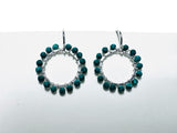 Hoop earrings with turquoise beads on a white background