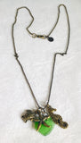 Sea Glass and Sea Creature Necklace green sea glass with brass turtle, starfish and seahorse charm on chain.